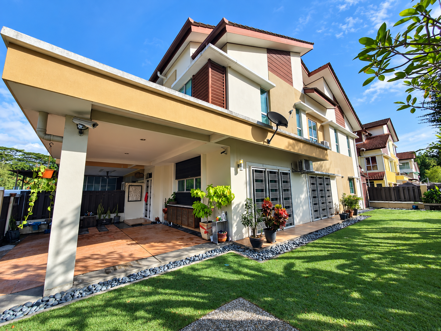 Corner terrace home with covered porch and landscaped side garden